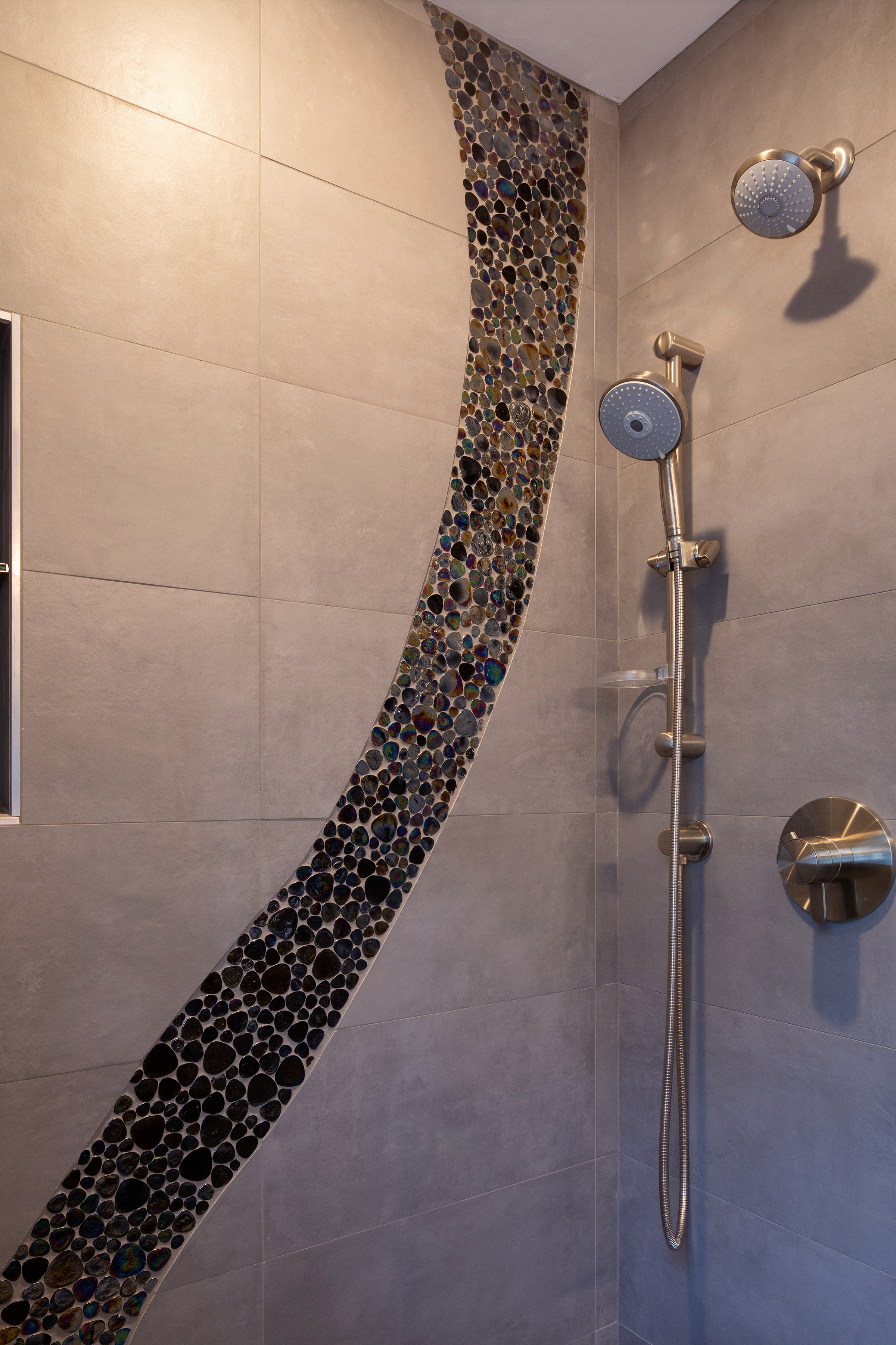 Curbless, accessible shower with waterfall design